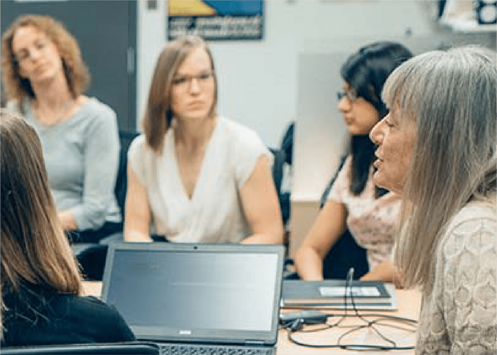 Room of female students in dicussion